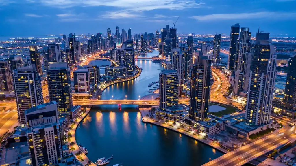 Airbnb Management in Business Bay: The Owner's Hiring Guide Business Bay canal and residential towers at dusk, Dubai