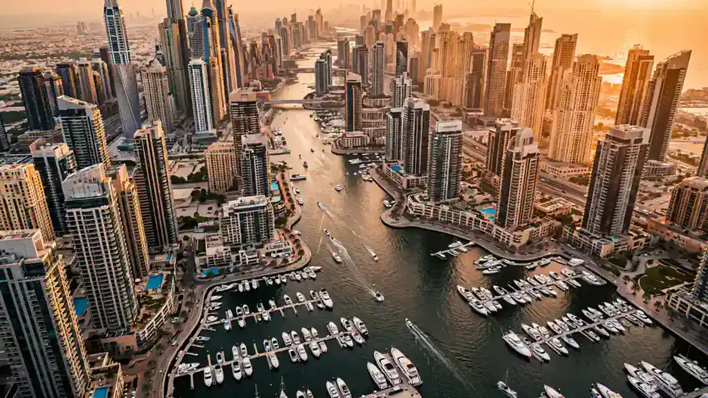 Airbnb Management in Dubai Marina: The Owner's Local Guide Aerial view of Dubai Marina hotel apartments and the bay