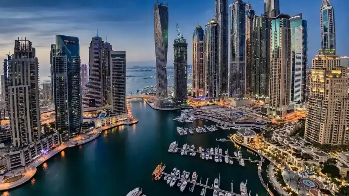 Airbnb Management in Dubai Marina: The Owner's Local Guide Dubai Marina towers at dusk, aerial view