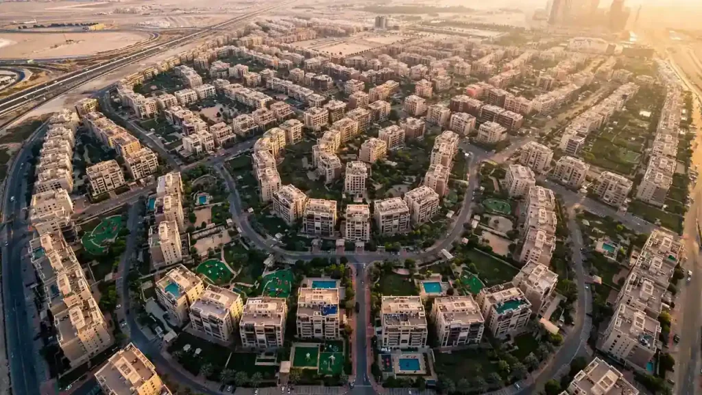 JVC Dubai residential tower cluster at sunset